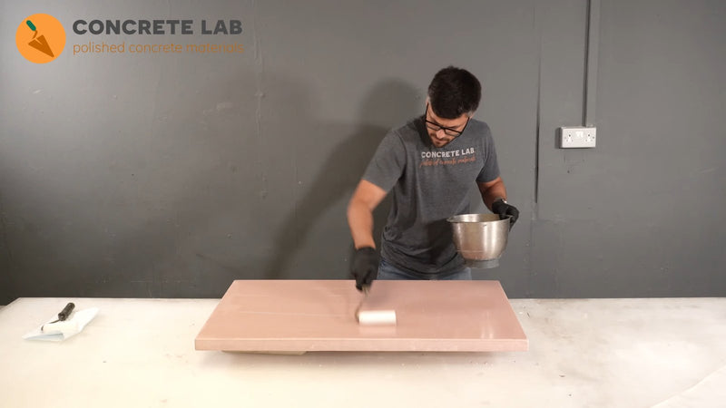 Rolling Concrete Lab Sealer onto a precast concrete worktop